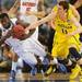 Michigan freshman Nik Stauskas guards Florida junior Patric Young as Young loses his footing during th second half at Cowboys Stadium on Sunday, March 31, 2013. Melanie Maxwell I AnnArbor.com